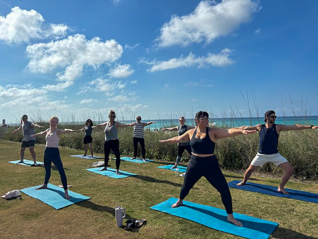 a group of people doing yoga on mats